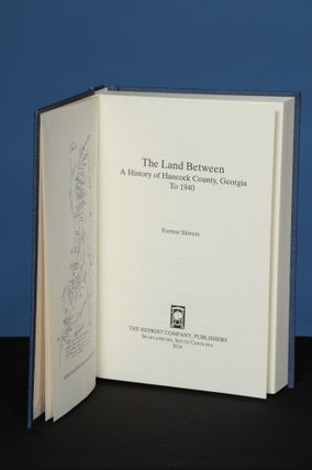 Item #129 THE LAND BETWEEN: A History of Hancock County, Georgia, to 1940. Forrest Shivers